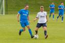 Matti King (blue) was on the scoresheet twice in a special testimonial match at Olivebank.
