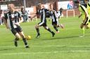 Dunbar United (black and white) lost out to Jeanfield Swifts at the weekend