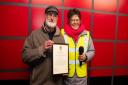 John Band receiving a Citizen Award from Pippa Swan, chairwoman of Dunbar Community Council