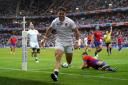 England’s Henry Arundell celebrates scoring their ninth try (PA)