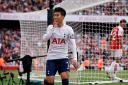 Son Heung-min celebrates scoring for Tottenham at Arsenal (David Cliff/AP/PA)