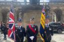 From left, Paul Cooper with the King's colour standard, Tony Hooman, national parade marshall, and William Morrison, carrying the area Legion standard at the Armed Forces flag-raising ceremony at Edinburgh City Chambers this year
