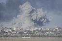 Smoke rises following an Israeli bombardment in the Gaza Strip, as seen from southern Israel on Monday, Dec. 11, 2023. (AP Photo/Ohad Zwigenberg).