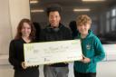 Bobbie McCann, Tapha Seydi and Aiden Jinks, from S3, with the £3,000 cheque destined for Teapot Trust