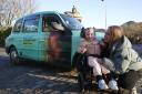 Freya Reily and mum Eilidh Mercer with a Sight Scotland-branded taxi which features her picture and her name on the side. It says: ‘A star pupil with sight loss? Meet Freya’. Image: Maverick Photo Agency
