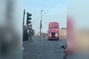 The youngsters were pictured hanging off of the back of a Lothian bus going into Port Seton