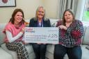 Taylor Wimpey's sales executive Donna Koch, centre, with First Step representatives Tina Pollock, project manager, right, and Michelle Maughan, family learning and development worker, left