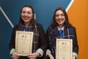 Twin sisters Kerra, left, and Dayle Stewart, pupils at Musselburgh Grammar School, with their 'Express Yourself' certificates after successfully completing a creative writing and drama course delivered by the Bridges Project in Musselburgh in