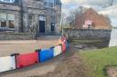 Flood barriers will be installed to the west of Goosegreen Bridge on New Street, Musselburgh, today (Monday) as a precautionary measure against coastal flooding, as shown in the photograph which was taken during a previous flooding event