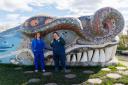 Ruth Impey, left, and Louise Nolan with Bella The Beithir, a 125-metre concrete serpent designed by artist Nichol Wheatley