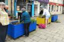 Volunteers get busy weeding the planters in the High Street