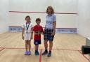 Rory Westgarth (centre) was celebrating success on the squash court