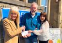 The £400 donation was handed over to Karl Cleghorn, chairman of the Hollies Community Hub's board of trustees, by Carol Edmond, pictured left, and Irene McLean, right, volunteers from the Over 50's Club in Musselburgh