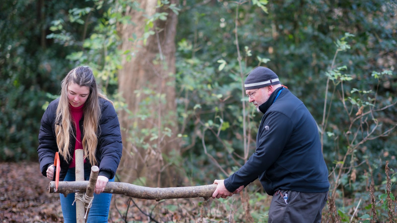 Queen Margaret University’s lecturer in initial teacher education, Patrick Boxall, teaches Eilidh Fleming, BA (Hons) Education Studies (Primary), some woodlands skills.