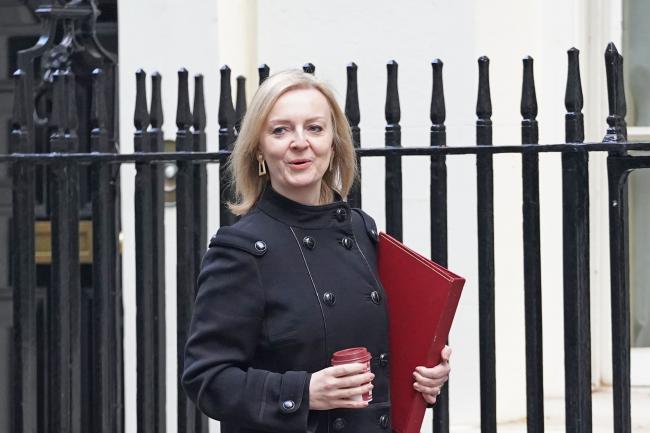 Foreign Secretary Liz Truss walks along