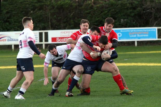 East Lothian Courier: Musselburgh (red), pictured during victory over Selkirk, wrap up their season with a trip to Aberdeen Grammar Rugby
