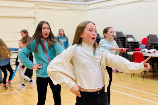 Bugsy Malone dancers rehearsing