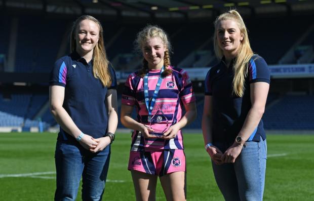 East Lothian Courier: Emily Love with her POTM award with Liz Musgrove and Megan Gaffney. Credit : Scottish Rugby/SNS