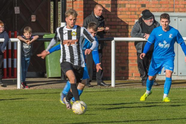 East Lothian Courier: Dunbar United (black and white stripes) welcome Crossgates Primrose to New Countess Park. Picture: Gordon Bell