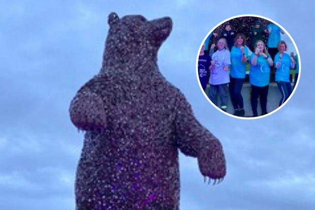East Lothian Courier: The DunBear was lit purple to show support to Cancer Research UK's Relay for Life, which is taking place in Dunbar this summer