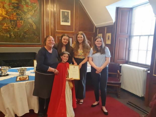 East Lothian Courier: Eve Allan, Isla Henderson and Abigail Sheridan, from Dunbar Grammar School charity committee, were awarded a Young Citizen Team Award by Jacquie Bell, secretary of Dunbar Community Council, and Civic Week Queen Bella Firstbrook. Picture: Kevin Searle
