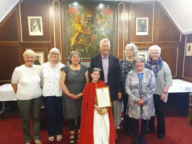 East Lothian Courier: Dunbar Dementia Network were presented with the Stephen Bunyan Trophy by Dunbar Civic Week Queen Bella Firstbrook and Alasdair Swan, treasurer of Dunbar Community Council. Picture: Kevin Searle