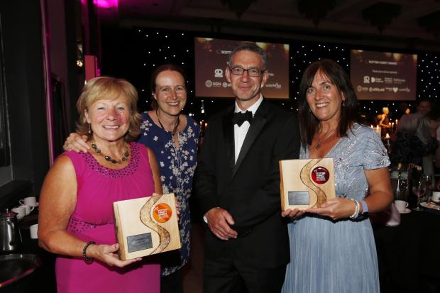 Leuchie House celebrate their double success at the 2022 Scottish Charity Awards, after winning prizes for Campaign of the Year (The Big Hare Trail) and Digital Citizen for their technology work. Pictured at the ceremony at the Crowne Plaza in Glasgow