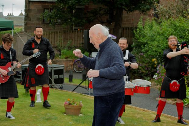 The Red Hot Chilli Pipers deliver their celtic rock music to county care homes - Graham Clark