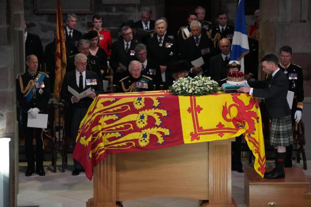 The Duke of Hamilton places the Crown of Scotland on the coffin during the service of remembrance for Queen Elizabeth II at St Giles’ Cathedral, Edinburgh. Image: Aaron Chown/PA Wire
