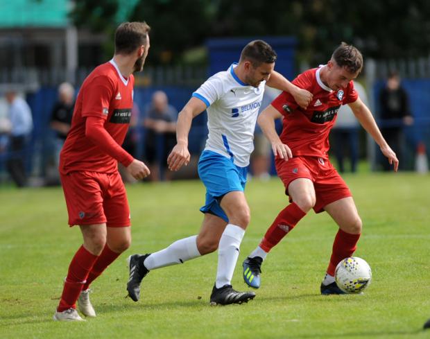 East Lothian Courier: Musselburgh Athletic (white) knocked Penicuik Athletic out of the Scottish Cup. Picture: Alan Wilson