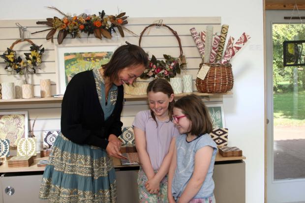 Kate Millbank, pictured alongside Emilia and Jess Wilkinson, is among the artists exhibiting at Amisfield Walled Garden