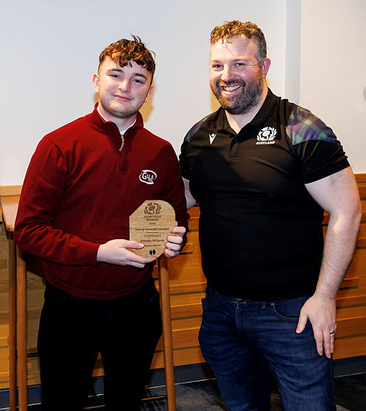 Ethan Wilson (left), alongside Ally Chalmers, east regional manager, received a top award from Scottish Rugby. Image: Scottish Rugby/SNS
