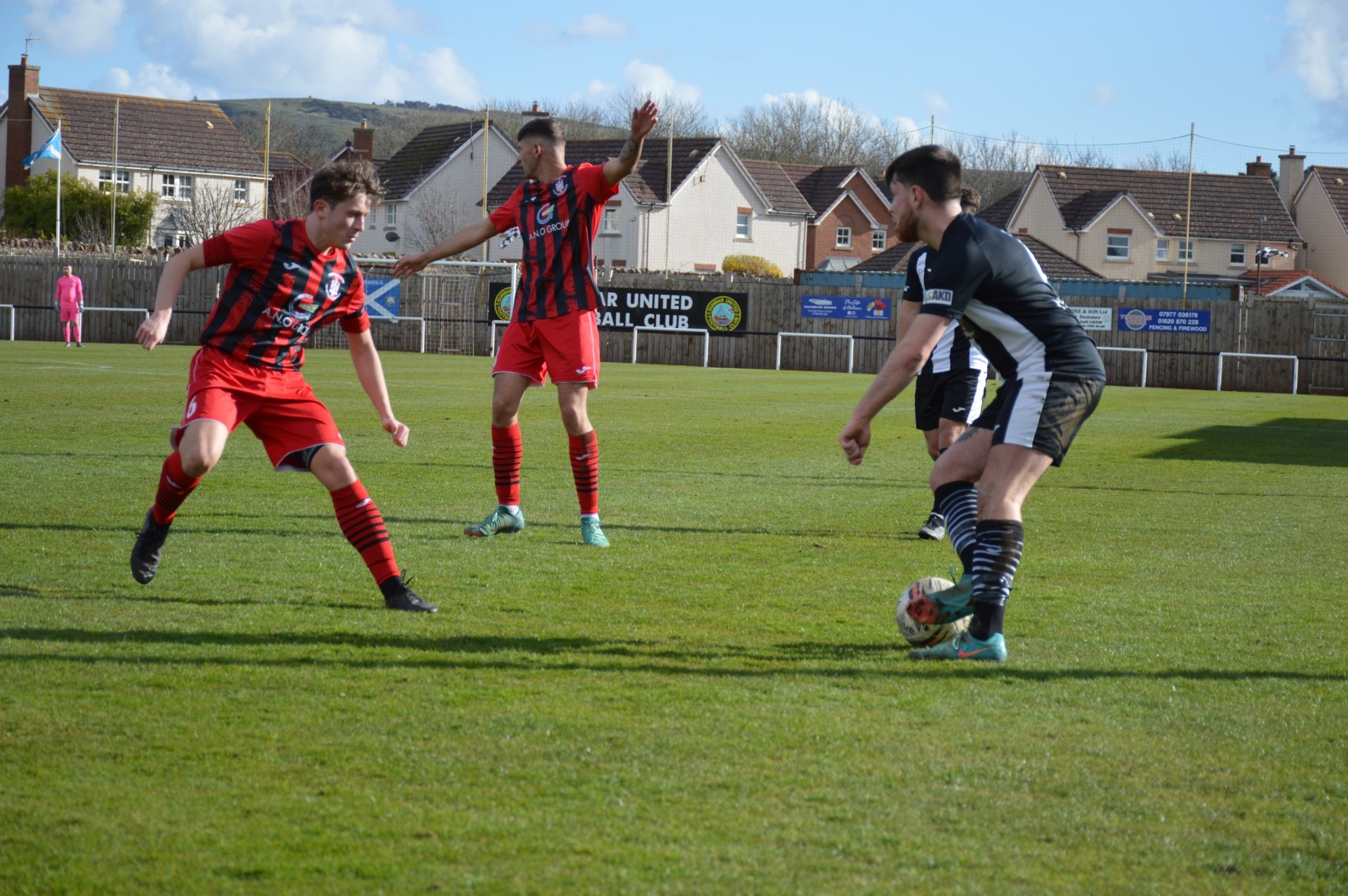 Dunbar United (black and white) continue their busy schedule with a trip to Dundonald Bluebell. Image: Gordon Maitland