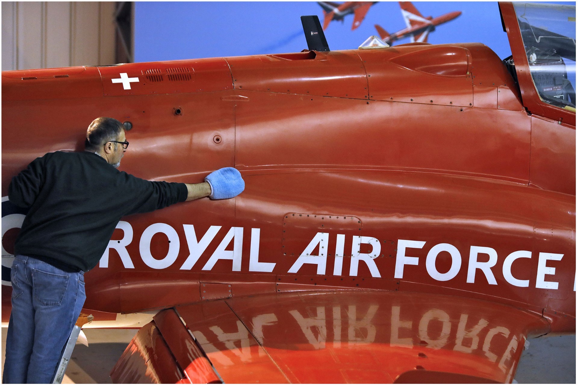 Principal Conservator, Stuart McDonald prepares a 1980 Red Arrows Hawk T.1A for the new visitor season at the National Museum of Flight, East Lothian. This year marks 25 years since the aircraft flew in Red 1 position over Edinburgh to mark the opening