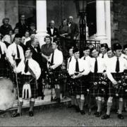 North Berwick Pipe Band at the time of its inauguration in 1957, with Tom standing third from left just behind the bass drum