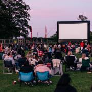 People attending an outdoor cinema event. Credit: Adventure Cinema