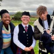 Charlie Mack, pictured with presenters Mwaksy Mudenda and Joel Mawhinney, claimed a Blue Peter badge thanks to his piping skills on the show last week