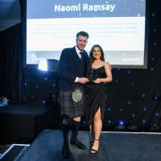 Naomi Ramsay is congratulated by awards host Cammy Wilson