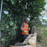 Apprentice stonemason Darren Brown at work on the boundary wall at the new learning campus at Wallyford