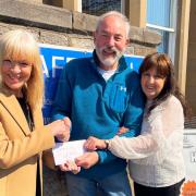 The £400 donation was handed over to Karl Cleghorn, chairman of the Hollies Community Hub's board of trustees, by Carol Edmond, pictured left, and Irene McLean, right, volunteers from the Over 50's Club in Musselburgh