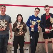 A number of trophies have been presented on the squash court in Haddington. From left: Andrew Light, Phoebe Hamilton, Jamie Pearman and Dylan Pearman