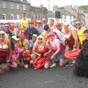 ‘Stars’ from ‘Wall Bay Watch’ – inspired by the TV series Baywatch – took part in the festival fancy dress parade last Friday in protest at the Musselburgh Flood Protection Scheme, highlighting concern about walls being put along the River