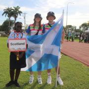 Stefan Krawiec and Niamh Trainer had the honour of carrying the Scotland flag during the opening ceremony of the Commonwealth Youth Games. Image: Commonwealth Games Scotland