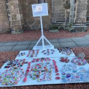 The pebbles and stand outside Abbey Church