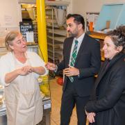 First Minister Humza Yousaf and Rural Affairs Secretary Mairi Gougeon at Dunbar Community Bakery, alongside the bakery's Isobel Knox. Image: Gordon Bell