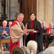 Jeonghee Min, organist at Northesk Church, receives her award for the 'most outstanding candidate' from David Hill MBE, president of The Royal College of Organists at Southwark Cathedral