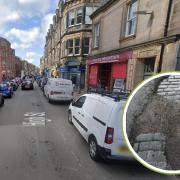Work to repair potholes on North Berwick High Street is being carried out today and tomorrow. Inset: An image of a pothole on North Berwick High Street taken by a member of the public