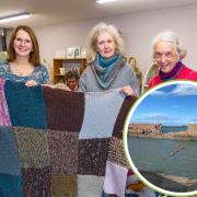 A group of knitters from North Berwick are attempting to 'fix' the damage to the town's harbour wall by knitting a banner to cover it. Image: Gordon Bell