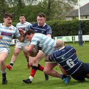 Musselburgh (blue) were aiming for a hat-trick of sevens titles when they took on Edinburgh Accies