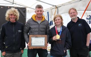 Stuart Bithell (second from left) met with East Lothian Yacht Club cadets and the club's commodore. Joining him are, from left: Roo Purves, Alastair Mackinnon (with gold medal) and Nick Roche (commodore of East Lothian Yacht Club). Picture: John